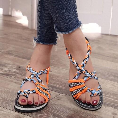 Explosions woven knot ladies sandals in Europe and America in summer and new flat-bottomed toe beach large-size sandals