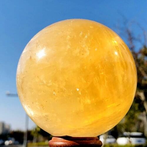 Natural calcite quartz crystal ball with polished mineral healing