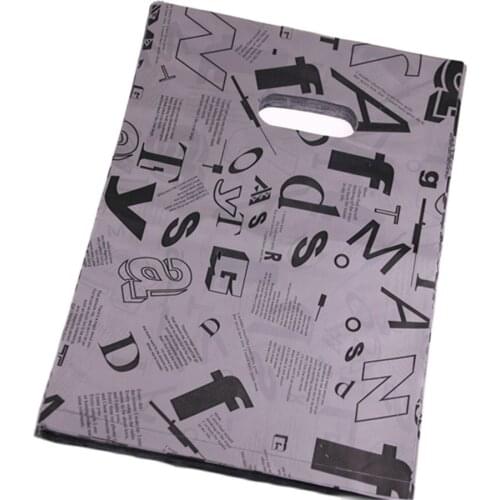 New Design Hot Sale Wholesale 100pcs/lot 25*35cm Luxury Fashion Letter Package Bags For Clothing Large Plastic Bags With Handles