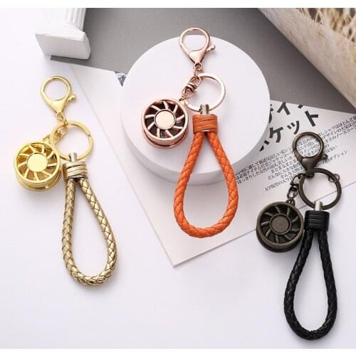 Trending European andAmerican Fashion Aromatherapy Keychain Stainless Steel Essential Oil Pendant Mens andWomens Bag Ornaments