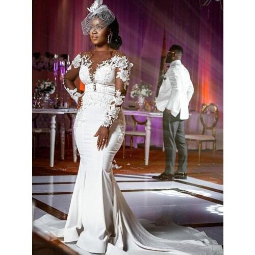 Plus Size Arabic Aso Ebi Cheap Lace Beaded Wedding Dresses Sheer Neck Mermaid Bridal Dresses Long Sleeves Wedding Gowns Vestido