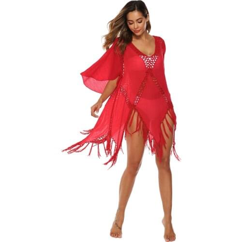 Bikini blouse Beach dress Solid color Irregular hand hook stitching tassel flared sleeves deep V sexy hollow beach dress