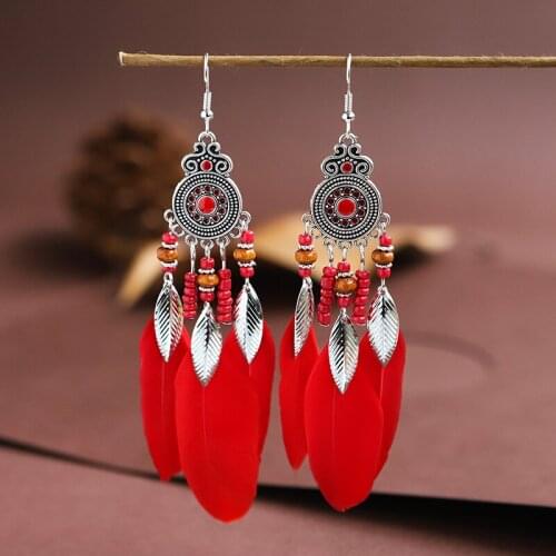 2021 New Womens Bohemian Earrings Feather Wooden Creative Flower Carved Silver Color Alloy Dripping Oil Long Tassel Earrings