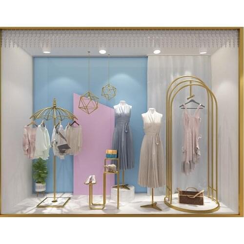 Clothes shop window props are hanging display rack gold creative umbrella hat stand on the floor