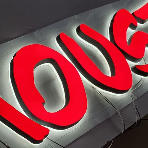 Wall-mounted double side lighted red acrylic cut letter vinyl surface