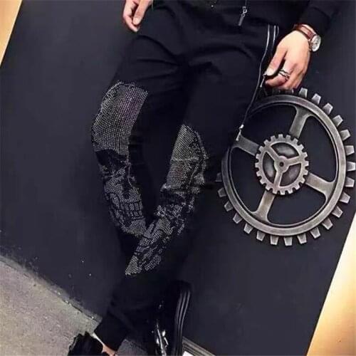 The New hot drilling skull brand mens casual pants mens dark thin feet design