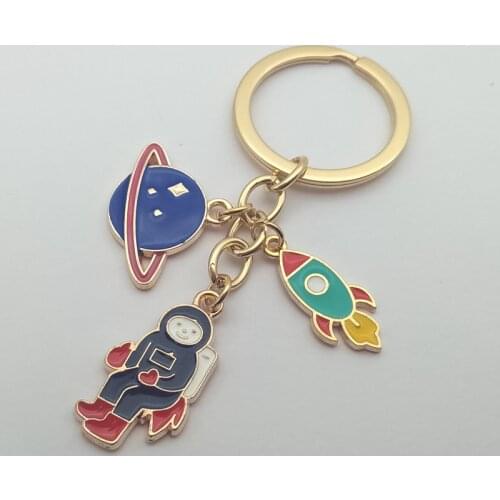 Escape from the earth ! UFO Space Craft Astronaut Rocket Planet Spaceman Universe Stars Enamel Key Ring KeyChain For astrophile