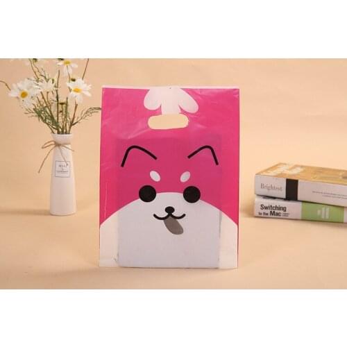 100psc Handbag clothing plastic handbag bag hand bag four finger bag clothing store bag