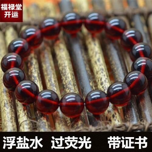 Wine red Succinum single ring ball floating on the Baltic saline fluorescence hand chain identification certificate