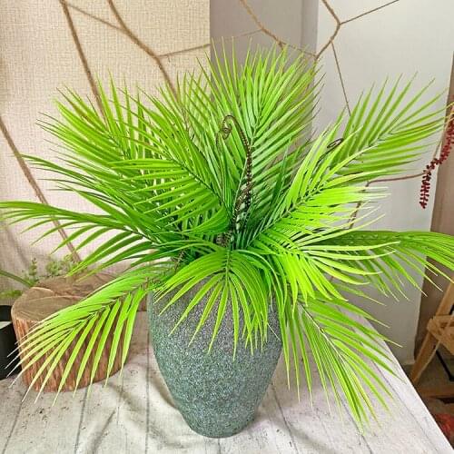 False loose sunflower leaves flower arrangement plant wedding photography background wall hotel wedding decoration fern grass