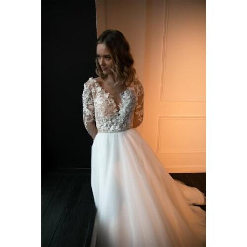 V-neck with Pearl Sash Ivory Bridal Dress with Beadings 3D Flowers Applique Bodice Long Sleeves Open Back Wedding Dress