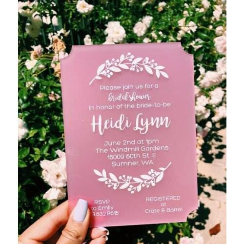 Pink acrylic wedding invitation with white leaves deisgn