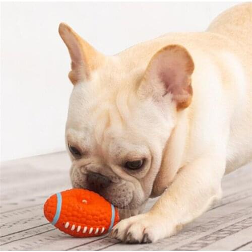 Sell Interesting Pet Latex Toy Dog Chewing Squeaky Toy Ball Outdoor Interactive Bite Rugby Football