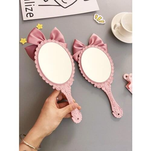 CSHOU199 Cute bowknot creative handle makeup mirror hand-held beauty salon makeup princess mirror portable mirror Pink color