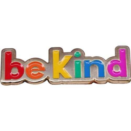 Rainbow colours recessed in matt gold toned metal badge cute colourful reminder