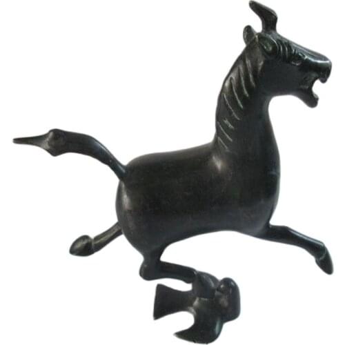 Ancient Chinese bronze statue. The horse stepped the swallow