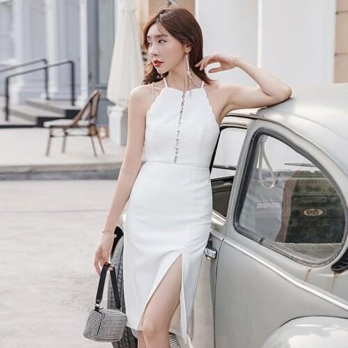 YIGELILA Autumn New Fashion White Dress Solid Sheath Sleeveless Hang Neck Dress Mid-calf Spaghetti Strap Women Dress 65301