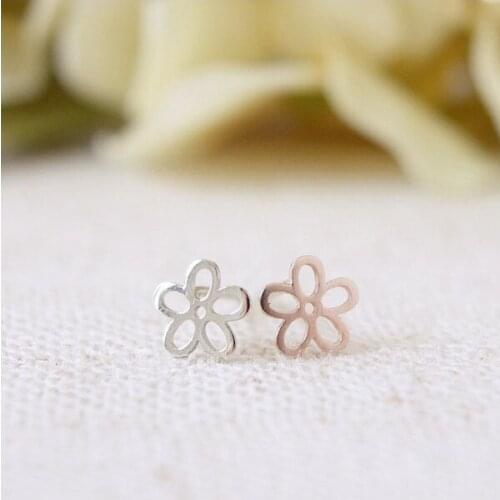 Fashion hollow out the five petals of stud earrings