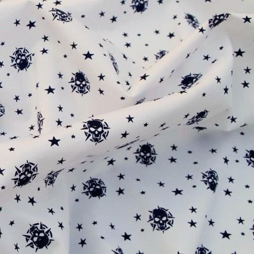 Cotton Woven Fabric - Skull and star printed on white background