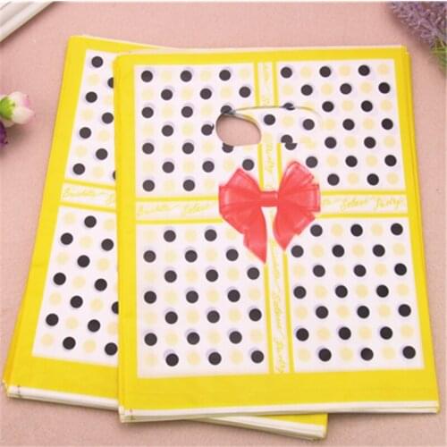 2017 New Design Wholesale 100pcs/lot 20*25cm Yellow Luxury Fashion Gift Packaging Bags With Dot Shopping Plastic Gift Bags