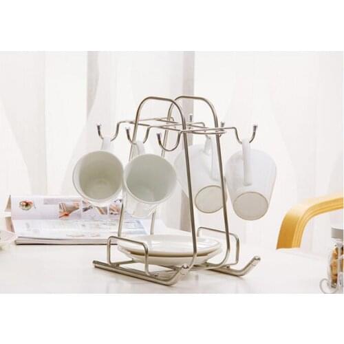 Kitchen shelf. The stainless steel cup frame. The plate rack. Home coffee cup wearing glasses receive frame