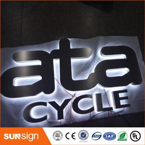 Brushed stainless steel backlit letters