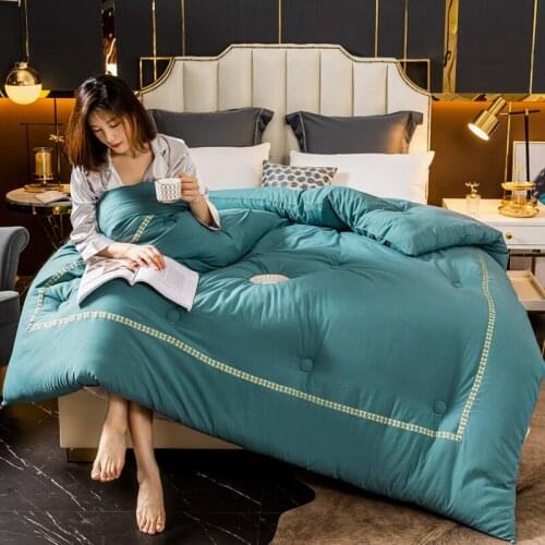 Spring and autumn quilt pure color hotel style light and comfortable breathable quilt core gift warm quilt feather velvet