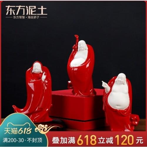 China red soil smiling Buddha maitreya furnishing articles ceramic gifts to send leadership office decoration process