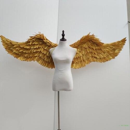A stage performance of gold and silver plumes of angel wings Catwalk model shows