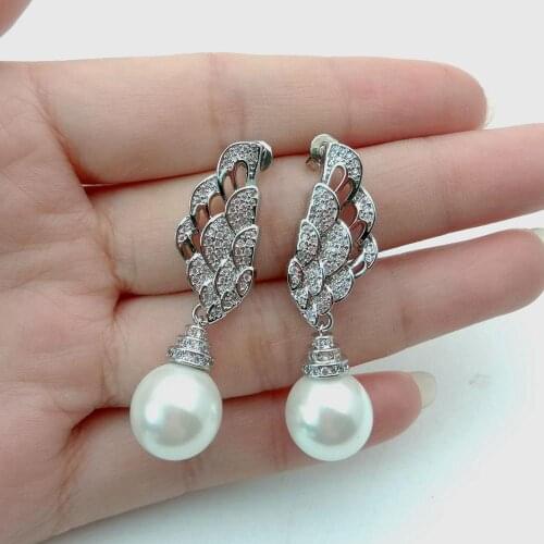 Yygem 12mm Womens Angel Wings Feathers White sea shell Pearl White Gold Plated Stud Earrings for Women