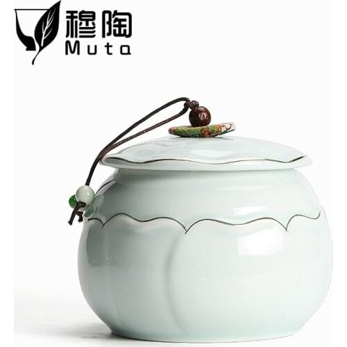 Mu Tao tea pot ceramic household large storage tank sealed pot tea warehouse gold creative packaging Tea caddy large jar te