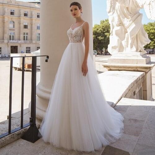 Boho Backless A-Line Wedding Dress 2021 Charming Sweep Train Appliques Tulle Sleeveless V-neck Bridal Gowns