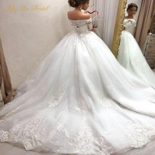 Bling Bling New Arrival Wedding Dresses Off the Shoulder Lace Appliques Corset Back Glitter Tulle Bridal Gowns with Train