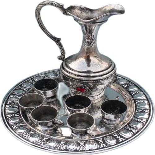 In ancient China, gold-plated silver opal teapot and cups and tray