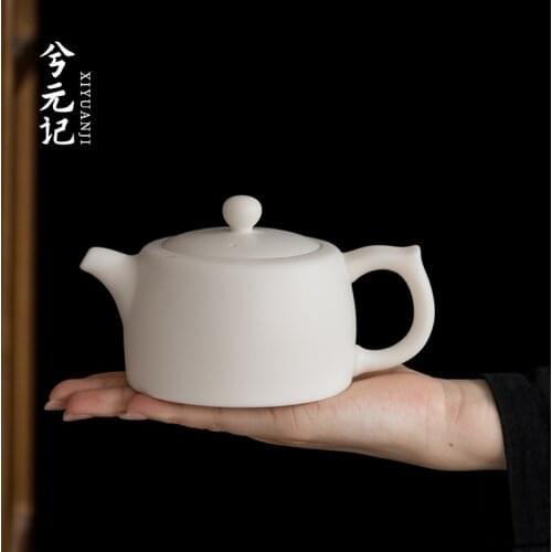 Porcelain biscuit firing ceramic household teapot dehua white porcelain teapot tea ball hole filter well bar single pot