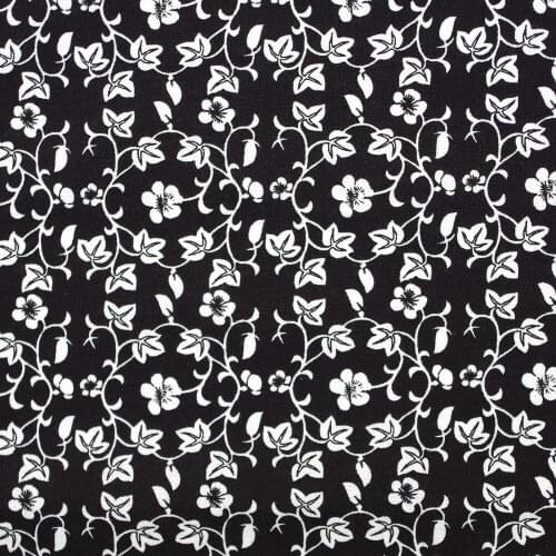 1 yard Cotton Woven Fabric - Small flowers and leaves on black background (width=145cm)