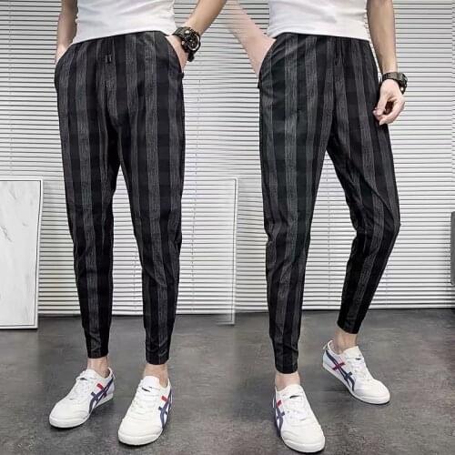 Spring and summer stretch mens plaid casual pants net red social spirit guy striped harem pants trend nine-point pants