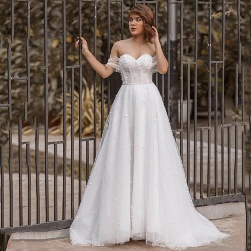 Eightree Princess Luxury Wedding Dresses Pearls Plus Size Wedding Gowns Beads Beach Bride Dress 2021 off Shoulder Abiti Da Sposa
