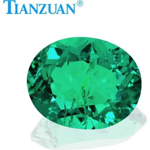 Oval shape Created Hydrothermal Columbia Emerald with minor cracks and inclusions inside of it loose gemstone