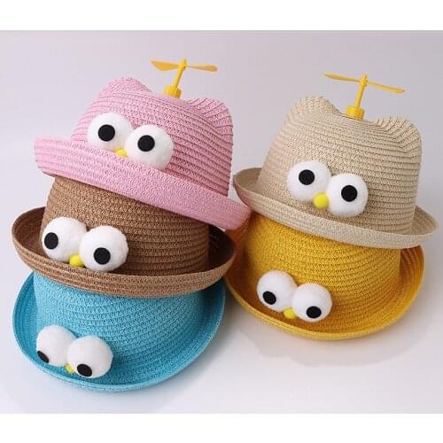 Summer windmill spinning kids straw hats big eyes decoration cute beach hats childrens personality girls boys sun hats