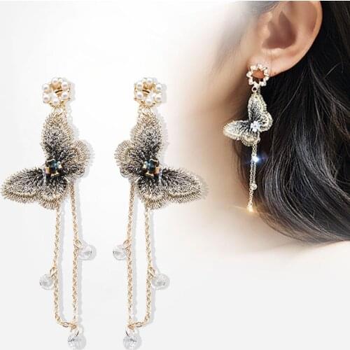 New temperament butterfly earrings Pearl tide simple personality Europe and the United States Joker long earrings women