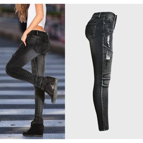Motorcycle style of European and American womens wear with holes, slim stretch, jeans and black pencil trousers