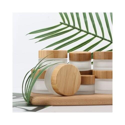 Custom Engraving Logo Frosted Glass Cbd Herb 100g Lip Gloss Packaging Jar For Cosmetic Eye Cream Face Cream Makeup Jar With Lid