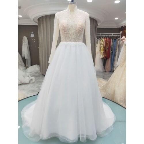 Floor Length Lace Appliques Sweep Train Long Sleeve V-Neck Wedding Dress Backless Backless Bridal Gowns Stunning High Quality