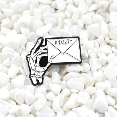Anxiety enamel pin skeleton hand Holding a letter brooch badge Trying to overcome anxiety Gothic punk style clothing accessories