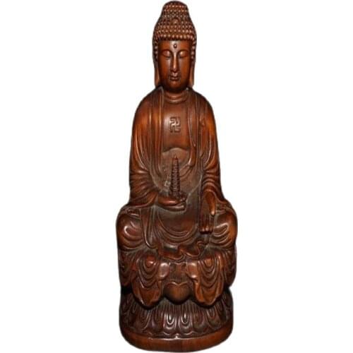 Wood carving decoration of the statue of Buddha in boxwood