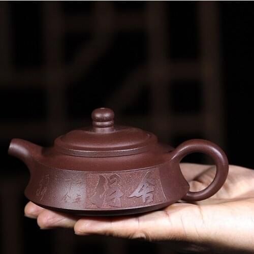 Handmade tea pot carved Taoism real yixing zisha authentic original ore pot old purple grit kungfu pot of tea on sales in China