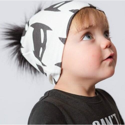 DUOJIAOYAN New winter childrens printed knitted hat cute fur ball baby ear protection cartoon woolen hat