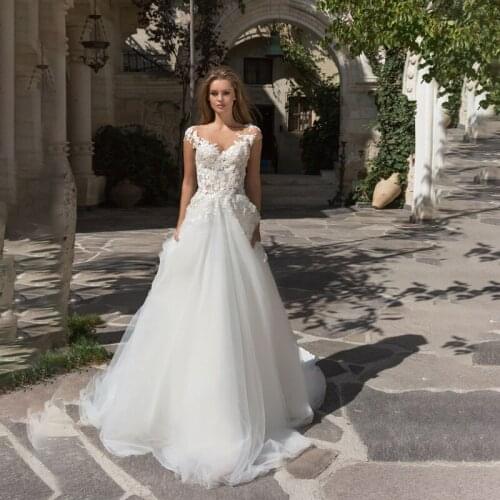 Sexy 2021 New Design V Neck Beach Wedding Dress Sleeveless A Line 3D Appliques Bridal Gowns Sweep Train Vestidos De Fiesta