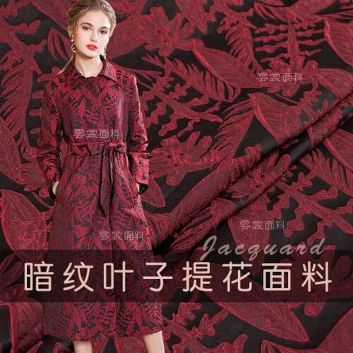 High-grade dark jacquard fabric fashion dress autumn and winter wind clothes fabric leaves embossed polyester fabric wholesale